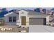 New single-story home with a gray roof, desert landscaping, and mountain views in the background at 8534 W Gehrig Way, Florence, AZ 85132