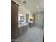 A luxurious bathroom with double vanities, wood cabinets, and a walk-in shower at 9027 S 19Th St, Phoenix, AZ 85042