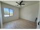 Bedroom features light wood floors and a large window for natural light at 9027 S 19Th St, Phoenix, AZ 85042