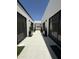 Exterior courtyard with modern landscaping between wings of the home at 9027 S 19Th St, Phoenix, AZ 85042