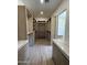 Walk-in closet featuring wood cabinetry with shelving and drawers for optimal storage at 9027 S 19Th St, Phoenix, AZ 85042