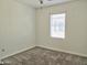 Neutral bedroom with a window, carpeted floors, and standard electrical outlets for versatile furniture arrangement at 9233 E Neville Ave # 1011, Mesa, AZ 85209