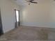 Light-filled bedroom featuring neutral tones, plush carpet, and a ceiling fan for added comfort at 9233 E Neville Ave # 1011, Mesa, AZ 85209