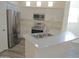 Modern kitchen boasts stainless appliances, white countertops, and ample cabinet space, inviting culinary adventures at 9233 E Neville Ave # 1011, Mesa, AZ 85209