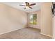 Comfortable bedroom featuring neutral carpet and a window with blinds at 9233 E Neville Ave # 1127, Mesa, AZ 85209