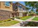 Attractive two-story townhome with a landscaped yard and inviting walkway at 9233 E Neville Ave # 1127, Mesa, AZ 85209