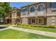 Well-maintained townhome with lush lawn and stone accents at 9233 E Neville Ave # 1127, Mesa, AZ 85209