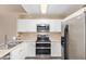 The kitchen features sleek, stainless steel appliances and lots of cabinet space at 9233 E Neville Ave # 1127, Mesa, AZ 85209
