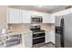 The kitchen features sleek, stainless steel appliances and lots of cabinet space at 9233 E Neville Ave # 1127, Mesa, AZ 85209