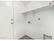A white laundry room with shelving and a utility sink at 9233 E Neville Ave # 1127, Mesa, AZ 85209