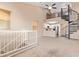 Spacious living area with spiral staircase and loft overlooking modern kitchen at 9233 E Neville Ave # 1127, Mesa, AZ 85209