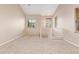 Bright, open living room with neutral walls and plush carpeting at 9233 E Neville Ave # 1127, Mesa, AZ 85209