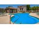 A community pool with lounge chairs and a gazebo, surrounded by apartments at 9233 E Neville Ave # 1127, Mesa, AZ 85209