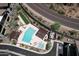 Aerial view of a community pool, lounge area and manicured landscaping at 1 Easy St # 17, Carefree, AZ 85377