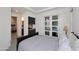 Cozy bedroom boasts a convenient coffee bar and access to a private balcony at 1 Easy St # 17, Carefree, AZ 85377