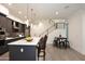Open-concept kitchen with marble island, stainless appliances, and adjacent dining area at 1 Easy St # 17, Carefree, AZ 85377