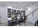 Modern kitchen with an island, stainless steel appliances, and sleek gray cabinets at 1 Easy St # 17, Carefree, AZ 85377