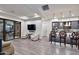 Open-concept living space featuring a modern kitchen, bar seating, and sliding doors at 1 Easy St # 17, Carefree, AZ 85377