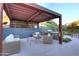 Covered patio with comfortable seating and a grill, creating an ideal outdoor living space for entertaining at 1 Easy St # 17, Carefree, AZ 85377