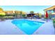 Community pool with ample seating, a pergola-covered lounge area, and beautifully maintained landscaping at 1 Easy St # 17, Carefree, AZ 85377