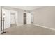 Open bedroom featuring wood floors and an en-suite bathroom and closet at 10330 W Thunderbird Blvd # B112, Sun City, AZ 85351