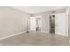 Spacious bedroom with neutral walls, wood flooring, and views of the en-suite bathroom at 10330 W Thunderbird Blvd # B112, Sun City, AZ 85351