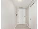 Clean hallway featuring light walls, wood floors and white doors at 10330 W Thunderbird Blvd # B112, Sun City, AZ 85351