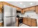 Traditional kitchen featuring stainless steel appliances and wooden cabinetry at 10330 W Thunderbird Blvd # B112, Sun City, AZ 85351