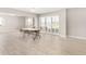 Large open living space with tile flooring and access to the outdoor views from large sliding doors at 10330 W Thunderbird Blvd # B112, Sun City, AZ 85351