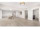 Spacious open-concept living space with tile floors, seamlessly connecting the kitchen and bathroom at 10330 W Thunderbird Blvd # B112, Sun City, AZ 85351