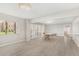 Inviting living room featuring tile flooring, abundant natural light, and a view of the community at 10330 W Thunderbird Blvd # B112, Sun City, AZ 85351