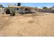Large backyard featuring a covered patio, perfect for outdoor entertaining and relaxation at 10831 W Heatherbrae Dr, Phoenix, AZ 85037