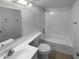 Well-maintained bathroom with a clean aesthetic, featuring a shower-tub combo and modern fixtures at 10831 W Heatherbrae Dr, Phoenix, AZ 85037