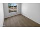 Bedroom with neutral carpet and a window providing natural light at 10831 W Heatherbrae Dr, Phoenix, AZ 85037