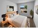 This bedroom offers a serene space with natural light and stylish decor, creating a welcoming and comfortable retreat at 10831 W Heatherbrae Dr, Phoenix, AZ 85037