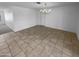 A clean dining area with tile flooring and bright lighting, ready for your personal touch at 10831 W Heatherbrae Dr, Phoenix, AZ 85037
