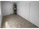 Utility room features tile flooring, a water heater, and washer dryer hookups at 10831 W Heatherbrae Dr, Phoenix, AZ 85037