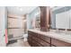 Modern bathroom with dual vanities, granite counters, and a tiled walk-in shower at 116 E Mountain Sky Ave, Phoenix, AZ 85048