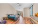 Bright bedroom with hardwood floors, queen bed, sleek side table, and sliding barn door at 116 E Mountain Sky Ave, Phoenix, AZ 85048