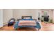 Cozy bedroom featuring a work space, hardwood floors, and plenty of natural light at 116 E Mountain Sky Ave, Phoenix, AZ 85048