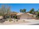 Inviting desert home with a tile roof, xeriscaping, and a neutral color scheme at 116 E Mountain Sky Ave, Phoenix, AZ 85048