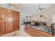 Open foyer with hardwood floors, a dining table, and a view of the living space at 116 E Mountain Sky Ave, Phoenix, AZ 85048