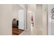 Open hallway with tile and wood floors, neutral walls, and natural light at 116 E Mountain Sky Ave, Phoenix, AZ 85048