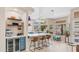Kitchen island features seating and wine fridge, offering a casual dining and entertaining space at 116 E Mountain Sky Ave, Phoenix, AZ 85048