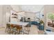 Open-concept kitchen with a large island, counter seating, and modern lighting at 116 E Mountain Sky Ave, Phoenix, AZ 85048