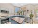 Stylish kitchen featuring quartz countertops, ample natural light, and desert views at 116 E Mountain Sky Ave, Phoenix, AZ 85048