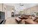 Open-concept living room with fireplace and views of the kitchen and backyard at 116 E Mountain Sky Ave, Phoenix, AZ 85048