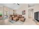 Spacious living room with vaulted ceilings, fireplace, and a plush sectional sofa at 116 E Mountain Sky Ave, Phoenix, AZ 85048
