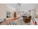 Inviting living area with hardwood floors, arched windows and comfortable seating arrangement at 116 E Mountain Sky Ave, Phoenix, AZ 85048