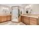 Spa-like bathroom featuring dual sinks, vanity, and a glass enclosed walk-in shower at 116 E Mountain Sky Ave, Phoenix, AZ 85048